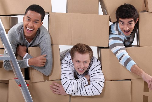 Local moving team handling furniture near Surrey Quays apartments
