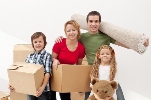 Professional movers loading household items for a Surrey Quays move