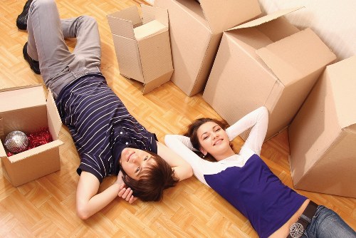 Team loading household items into a removals van