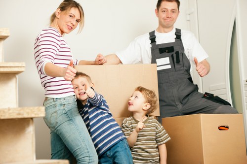 Local moving truck loading furniture near Surrey Quays